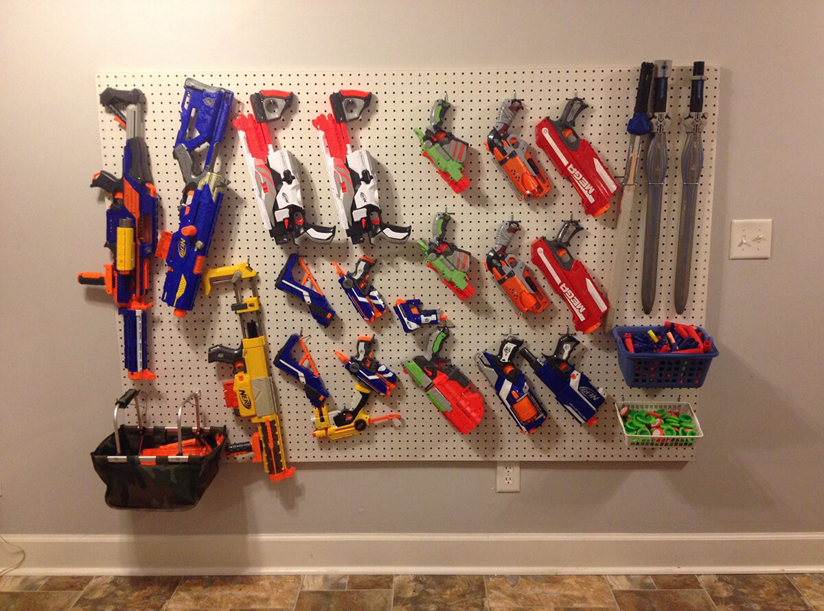 Hang nerf guns with wooks or pegboards.